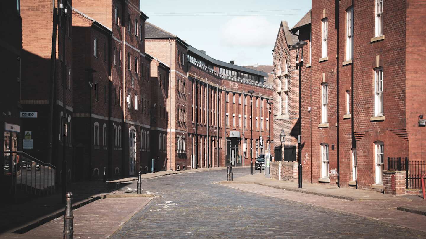 Brown buildings lining a street in Leeds, UK