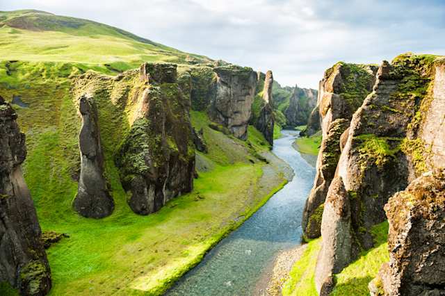 A view of Fjadrargljufur canyon with green rocks in summer, Iceland