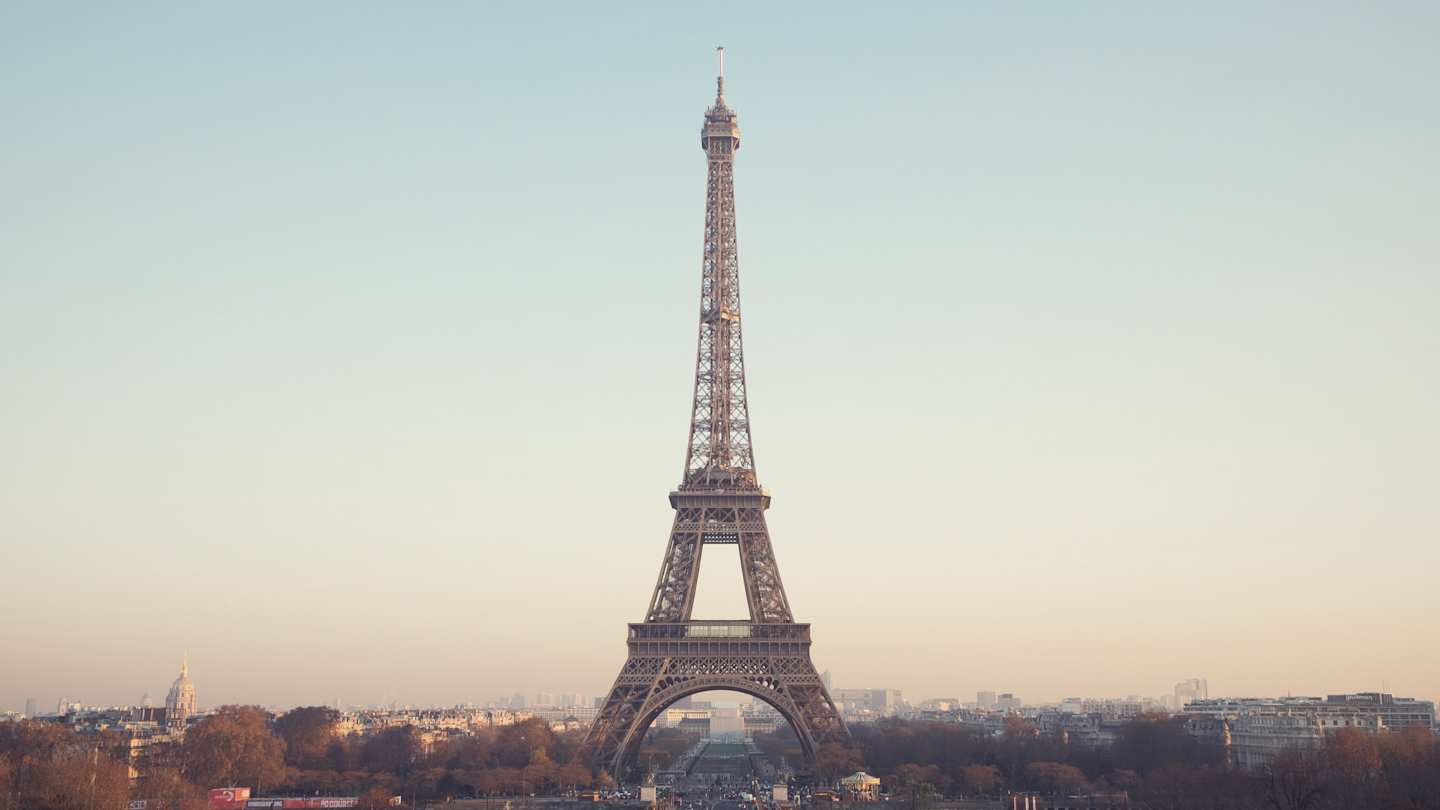 Eiffel Tower under hazy blue sky, Paris
