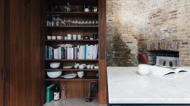 Items on kitchen shelves in Copper Cabana, Plum Guide home in London