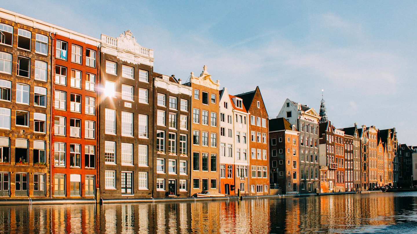 Terraced buildings alongside a canal in Amsterdam, Netherlands