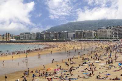 Beach filled with people in San Sebastian, Spain