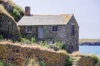 A brick coastal cottage by a lake, UK