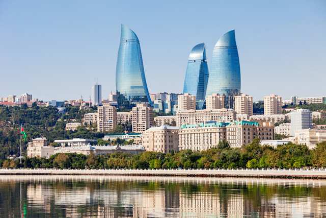 A view of tall, quirky skyscrapers standing above the city in Baku, Azerbaijan