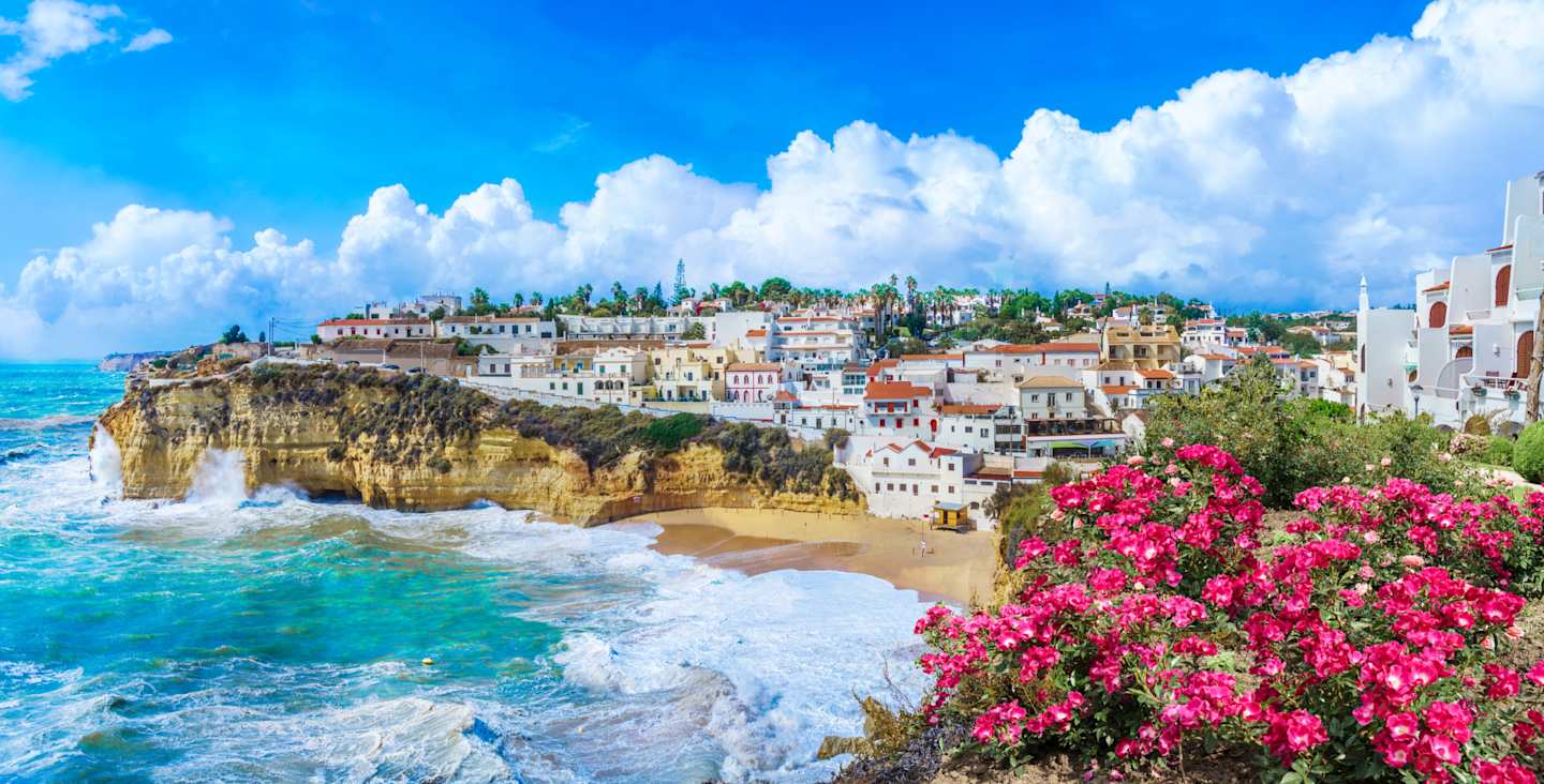 Carvoeiro town with colorful houses and yellow sand beach, Algarve, Portugal