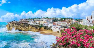 Carvoeiro town with colorful houses and yellow sand beach, Algarve, Portugal
