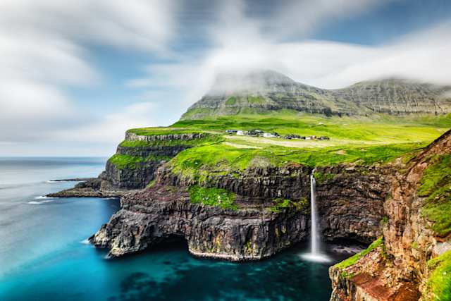 An aerial view of Mulafossur waterfall in Gasadalur, Vagar Island, Faroe Islands