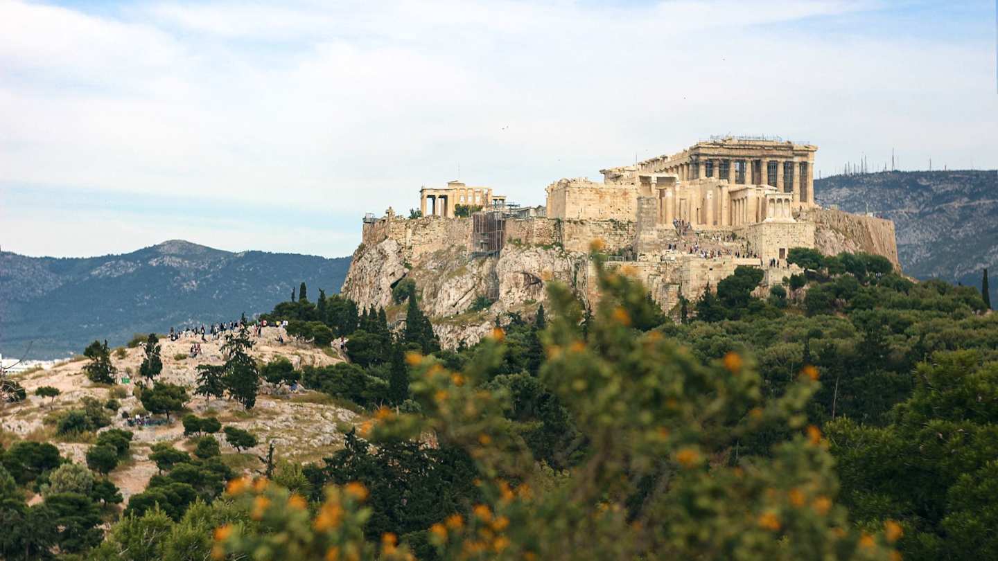 A view of the Acropolis of Athens, with orange trees in the foreground, Athens, Greece