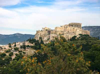 A view of the Acropolis of Athens, with orange trees in the foreground, Athens, Greece