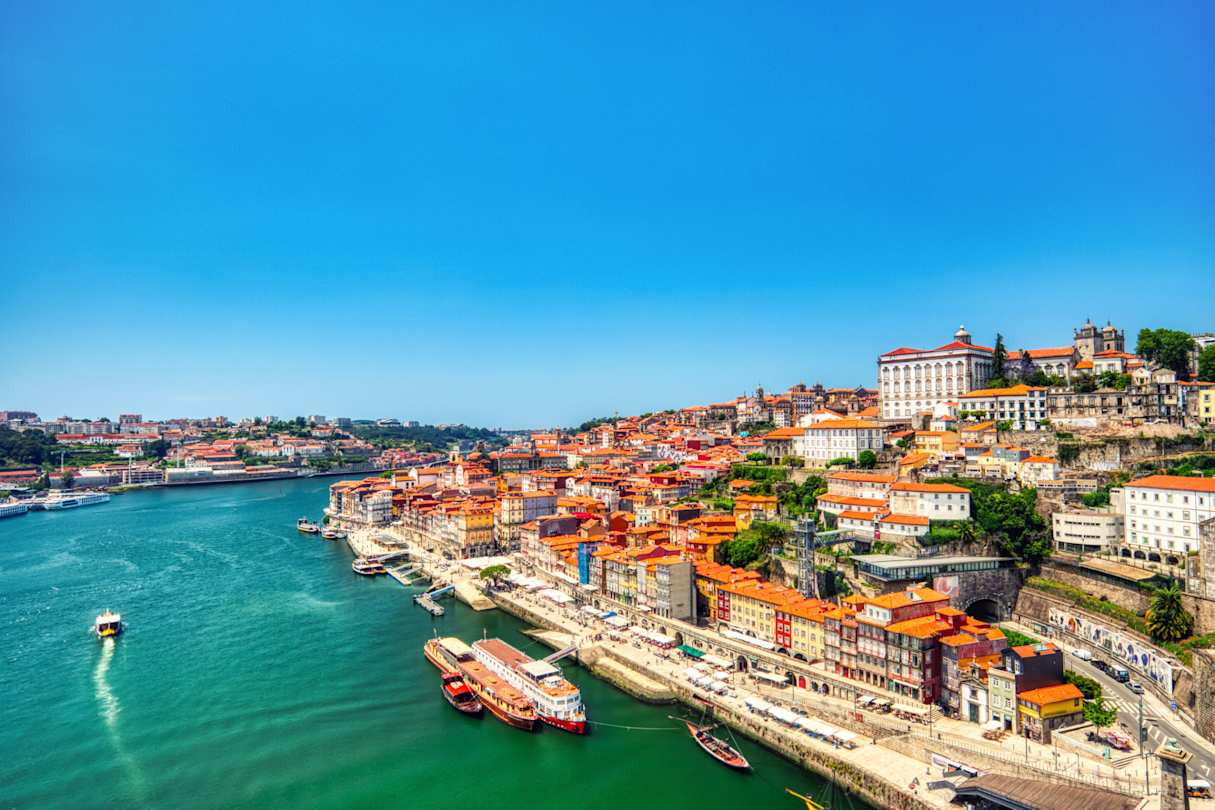 Cityscape over the Douro River and the colourful waterfront during a sunny day, Porto