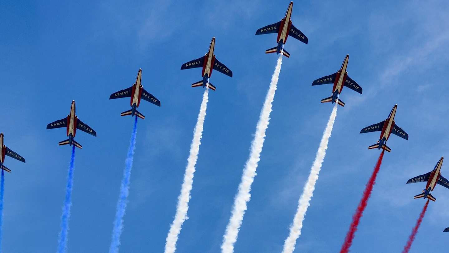 Planes flying over Paris with colours of French flag for Bastille Day
