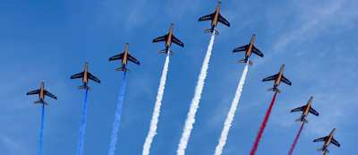 Planes flying over Paris with colours of French flag for Bastille Day