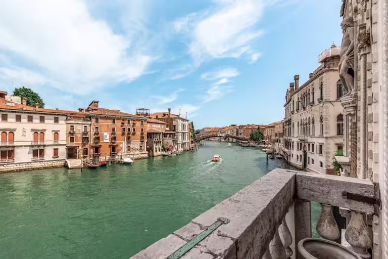 The Loredan's concrete balcony with views of the canal, bridge and gondolas, Venice