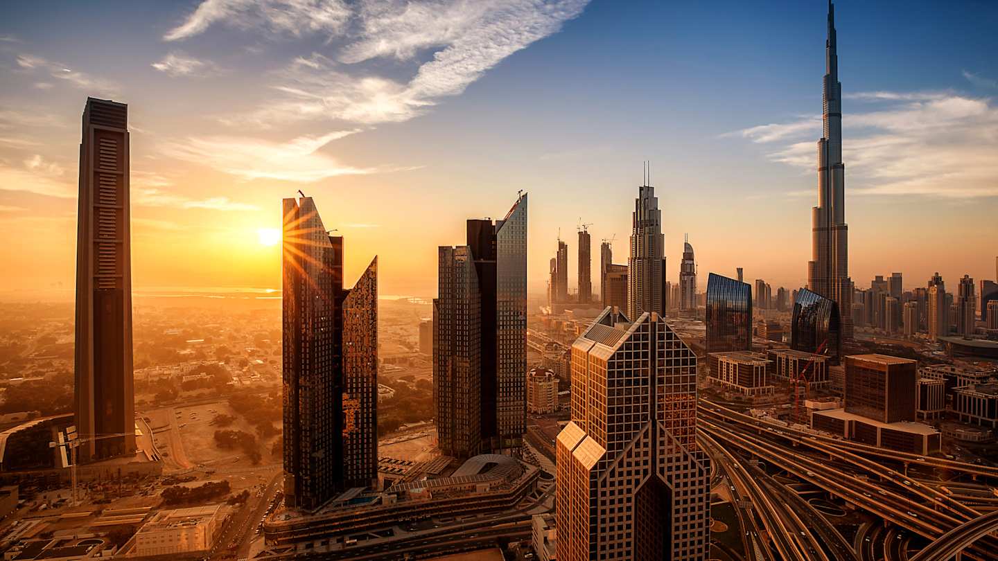 An aerial view of skyscrapers in downtown Dubai at sunrise, Dubai, UAE