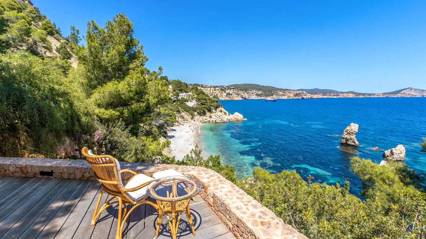 View of the beach from Cliffhanger, Plum Guide home in Ibiza