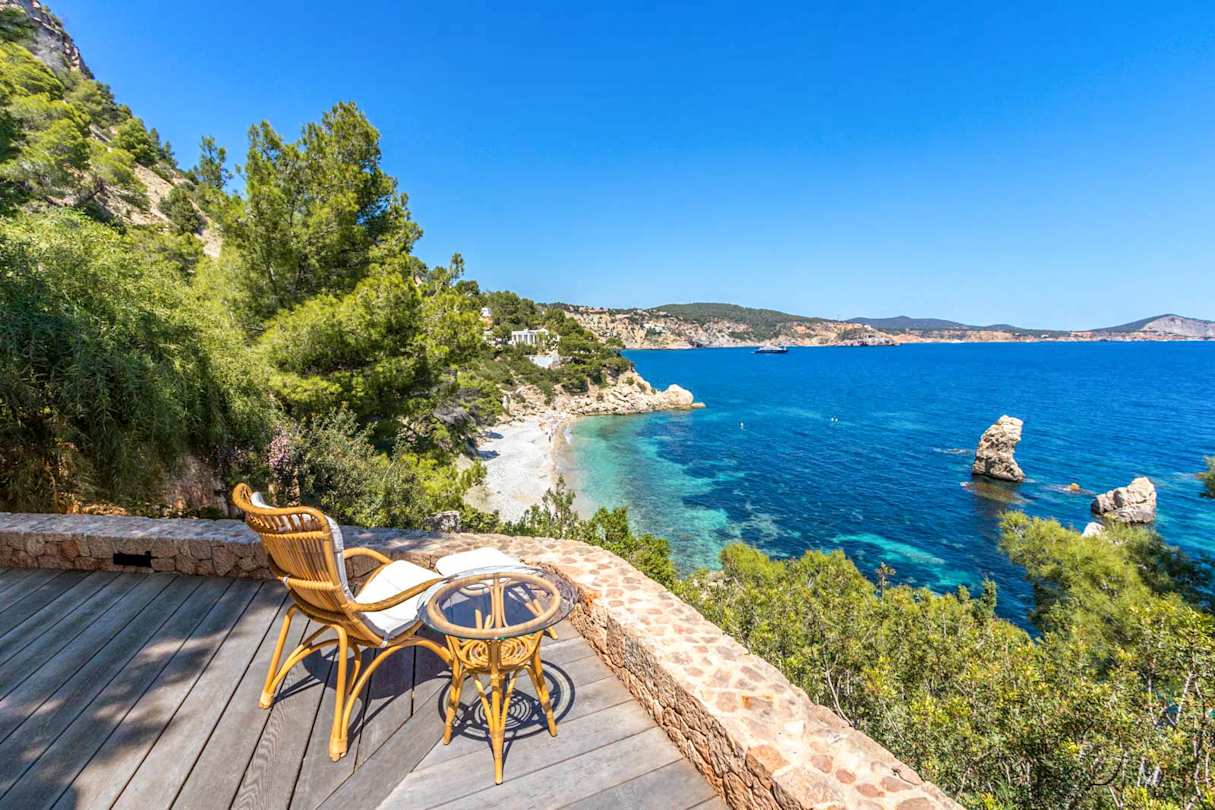 View of the beach from Cliffhanger, Plum Guide home in Ibiza