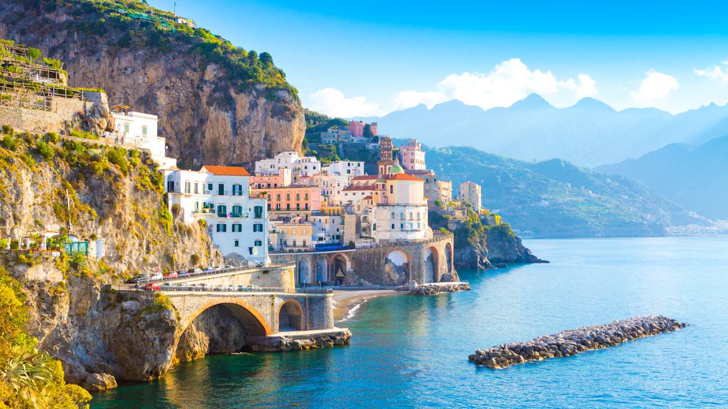 A view of coastal buildings by the sea on a sunny day in summer, Amalfi Coast, Italy