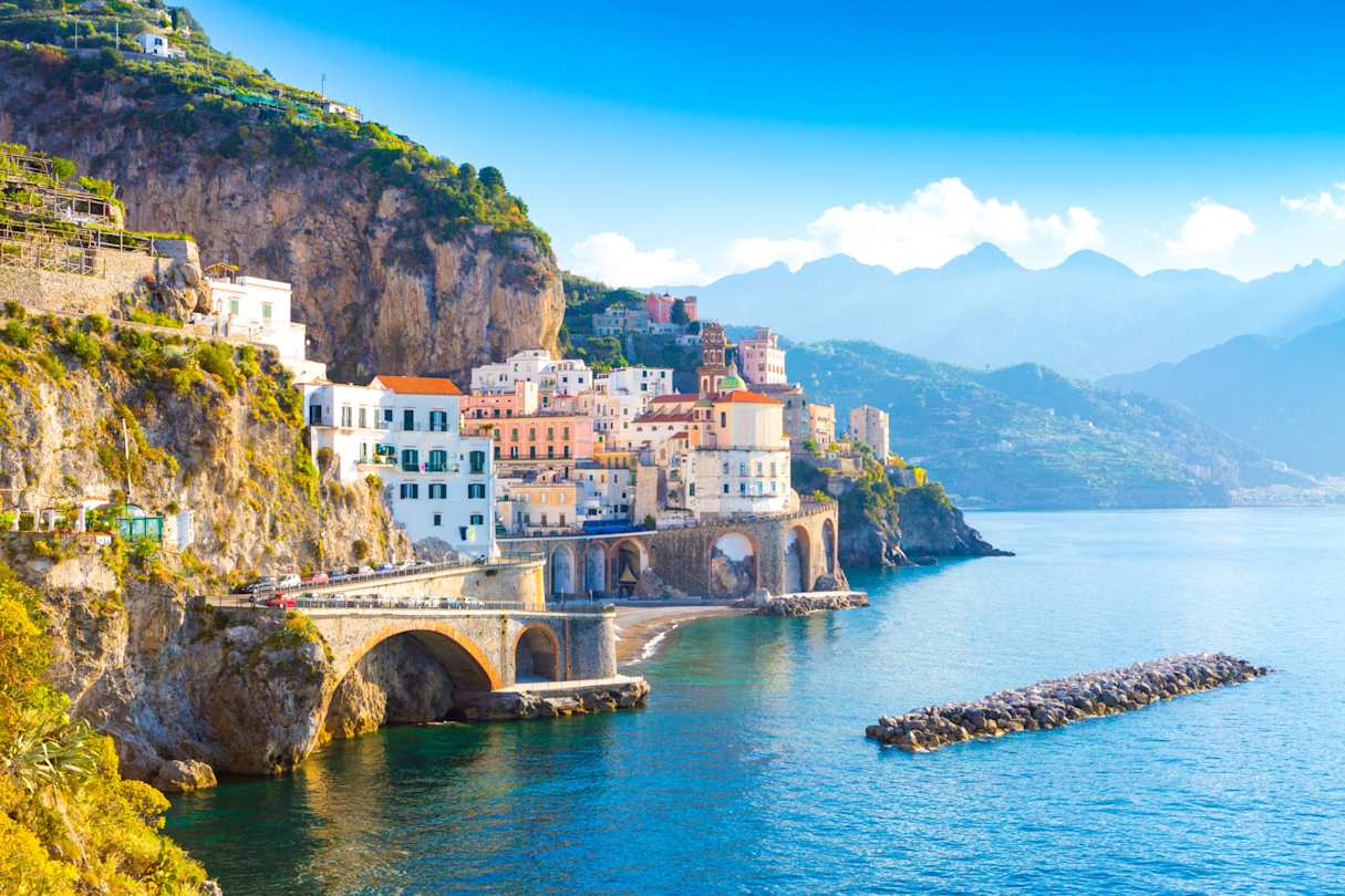 A view of coastal buildings by the sea on a sunny day in summer, Amalfi Coast, Italy