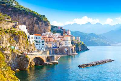 A view of coastal buildings by the sea on a sunny day in summer, Amalfi Coast, Italy