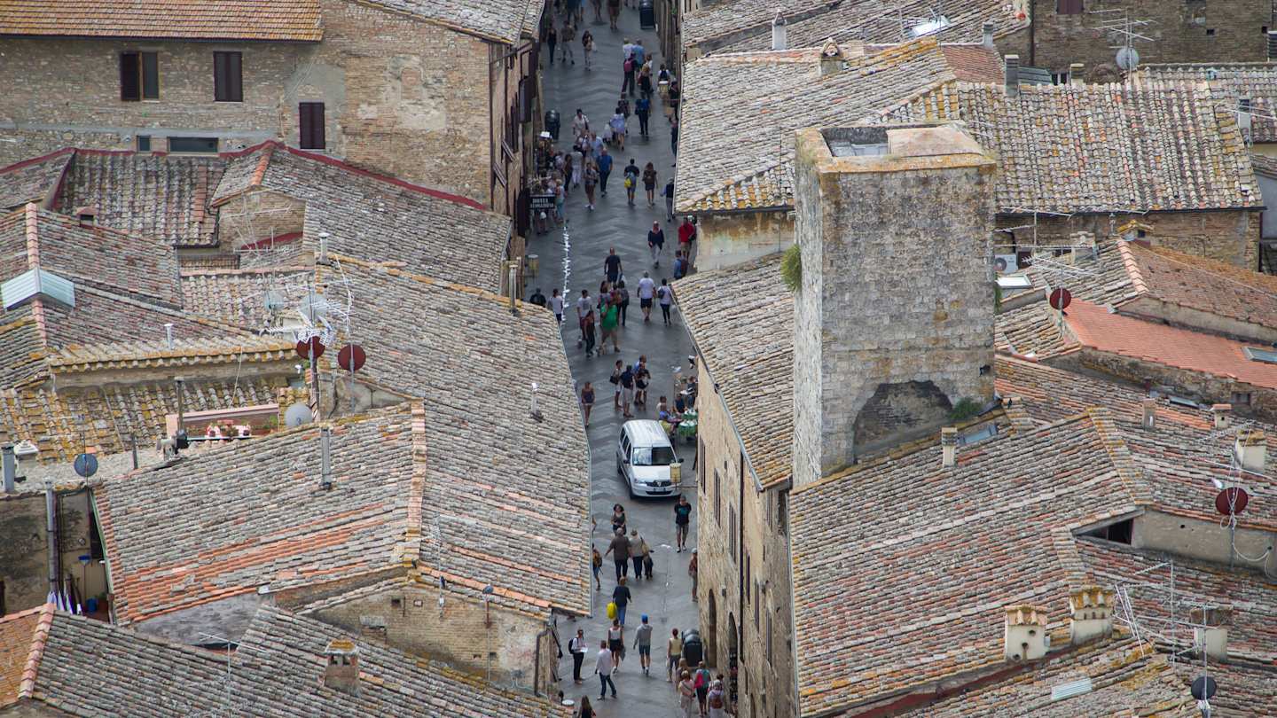 Car in San Gimignano street in Tuscany, Italy