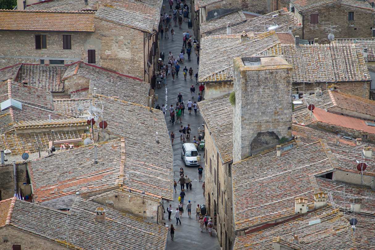 Car in San Gimignano street in Tuscany, Italy