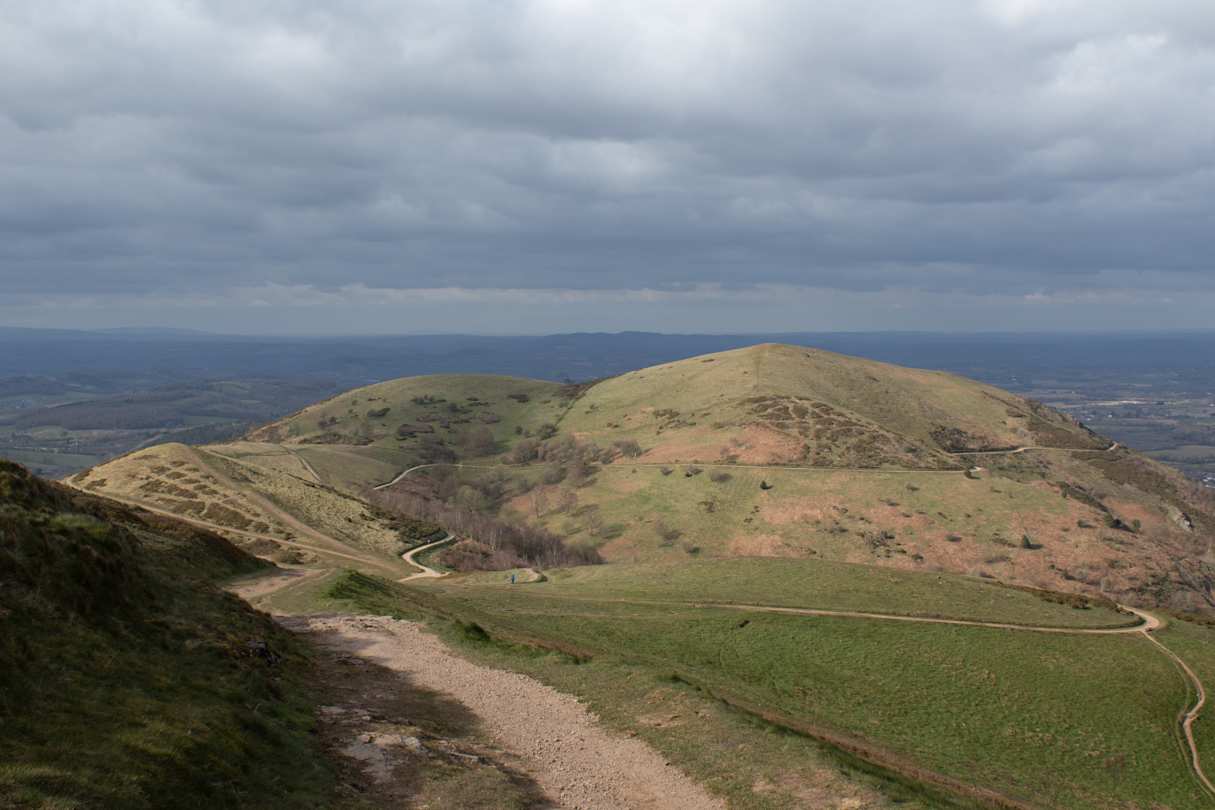 A view over green hills and meadows from the top of the Malvern Hills, Herefordshire, England, UK