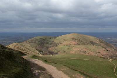 A view over green hills and meadows from the top of the Malvern Hills, Herefordshire, England, UK