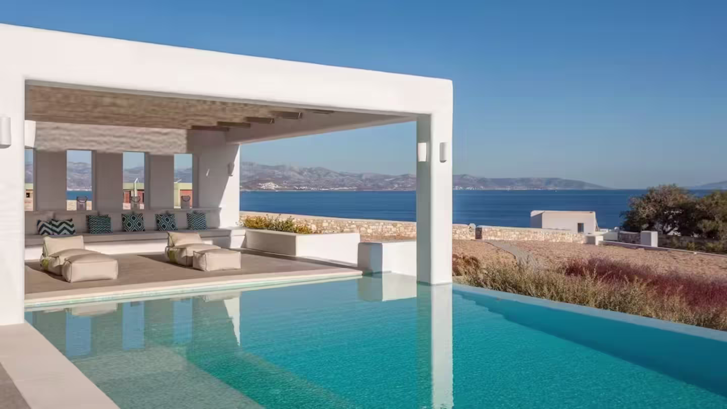 Plum home 'Reflect & Illuminate', with its infinity pool, white-washed pergola, and views of the sea, Paros, Greece