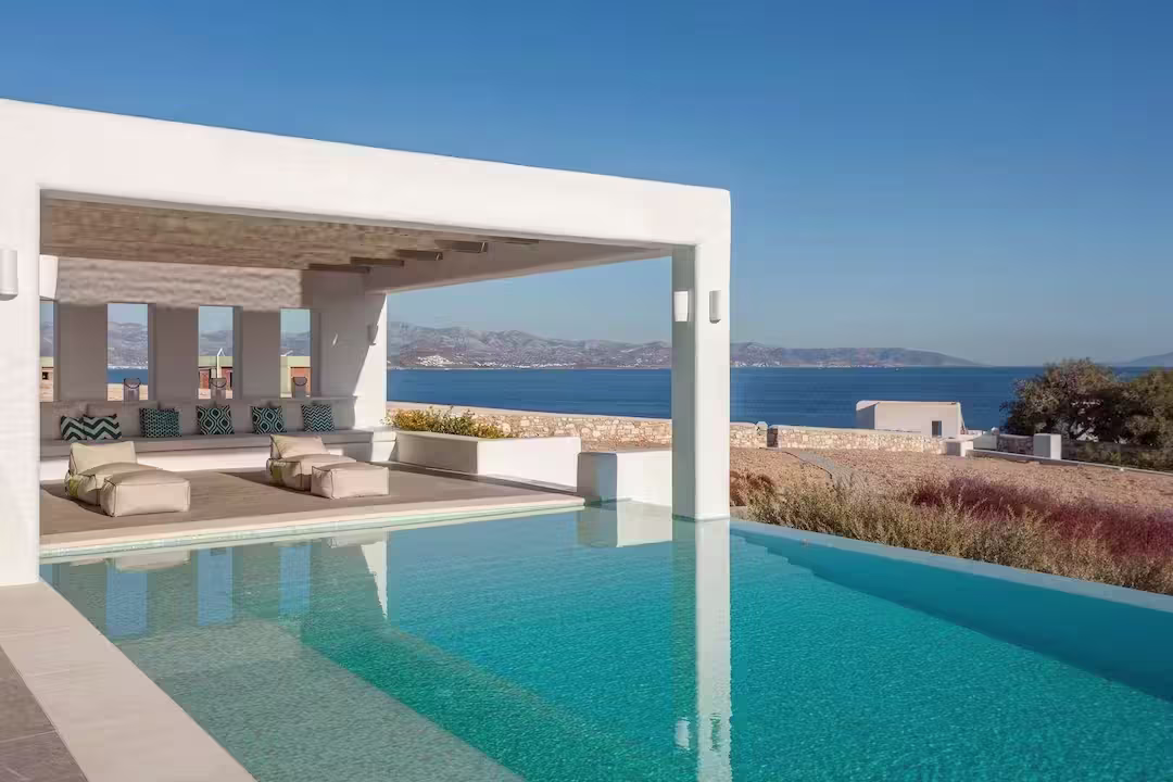 Plum home 'Reflect & Illuminate', with its infinity pool, white-washed pergola, and views of the sea, Paros, Greece