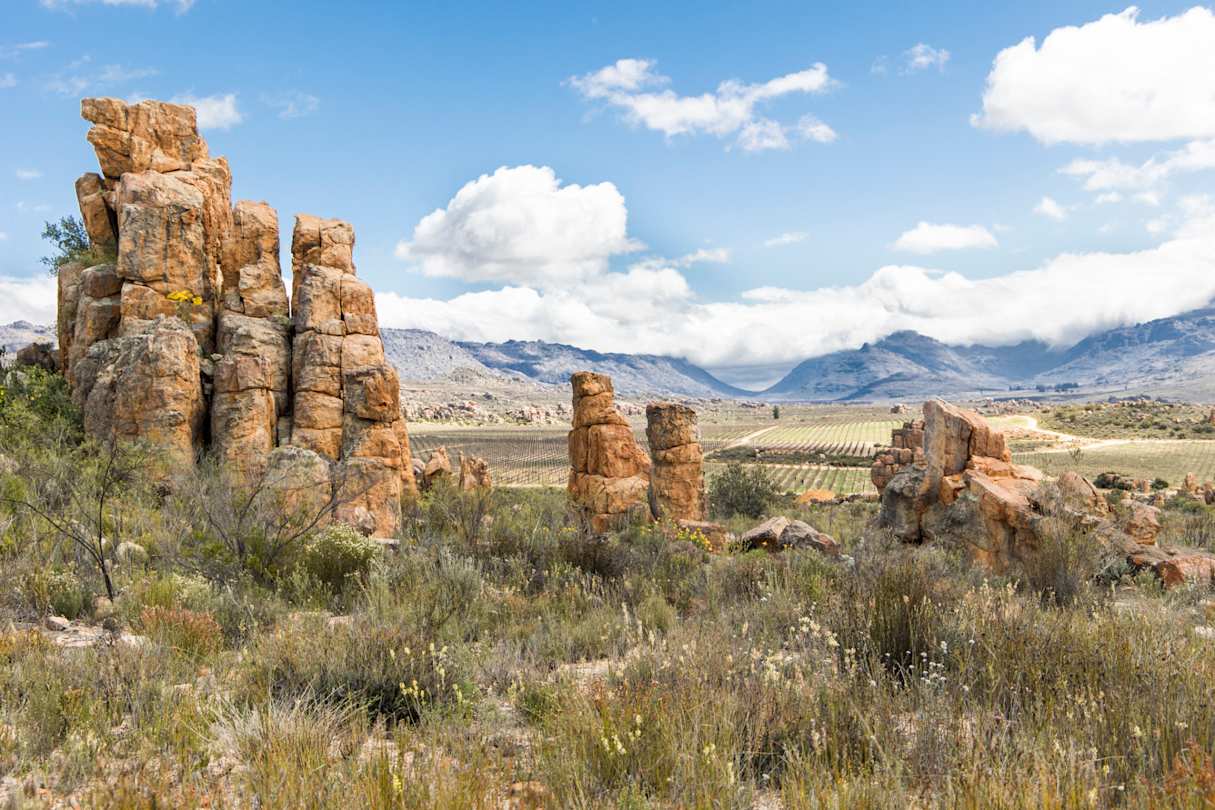 Landscape of interesting rock formations in the Cederberg mountains with cloudy blue sky, Cape Town