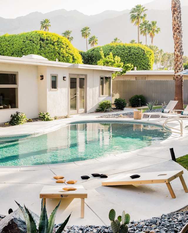 Pool area of Holiday Glow, Plum Guide home in Palm Springs