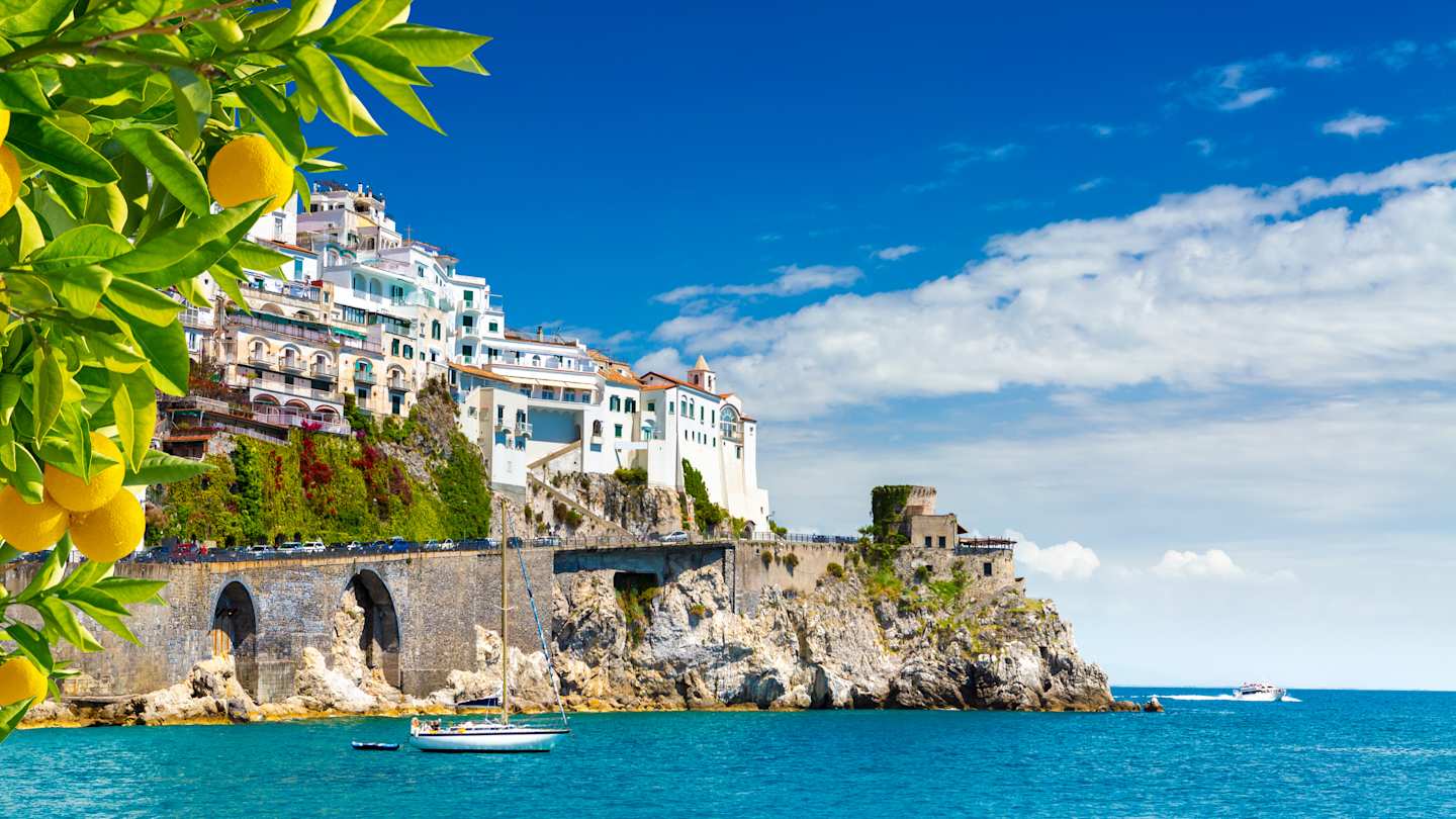 View of white-washed houses facing the Mediterranean sea, with lemons in the foreground, Sorrento