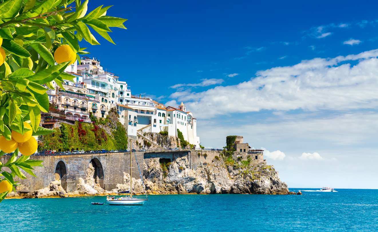 View of white-washed houses facing the Mediterranean sea, with lemons in the foreground, Sorrento
