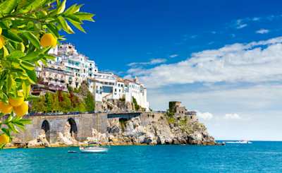 View of white-washed houses facing the Mediterranean sea, with lemons in the foreground, Sorrento