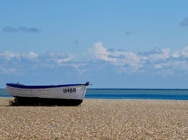 Boat on a beach in Aldeburgh in the summer, Suffolk, England, UK