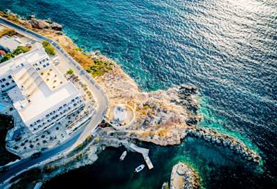 A bird's eye view of a coastal village by the sea in Paros, Greece