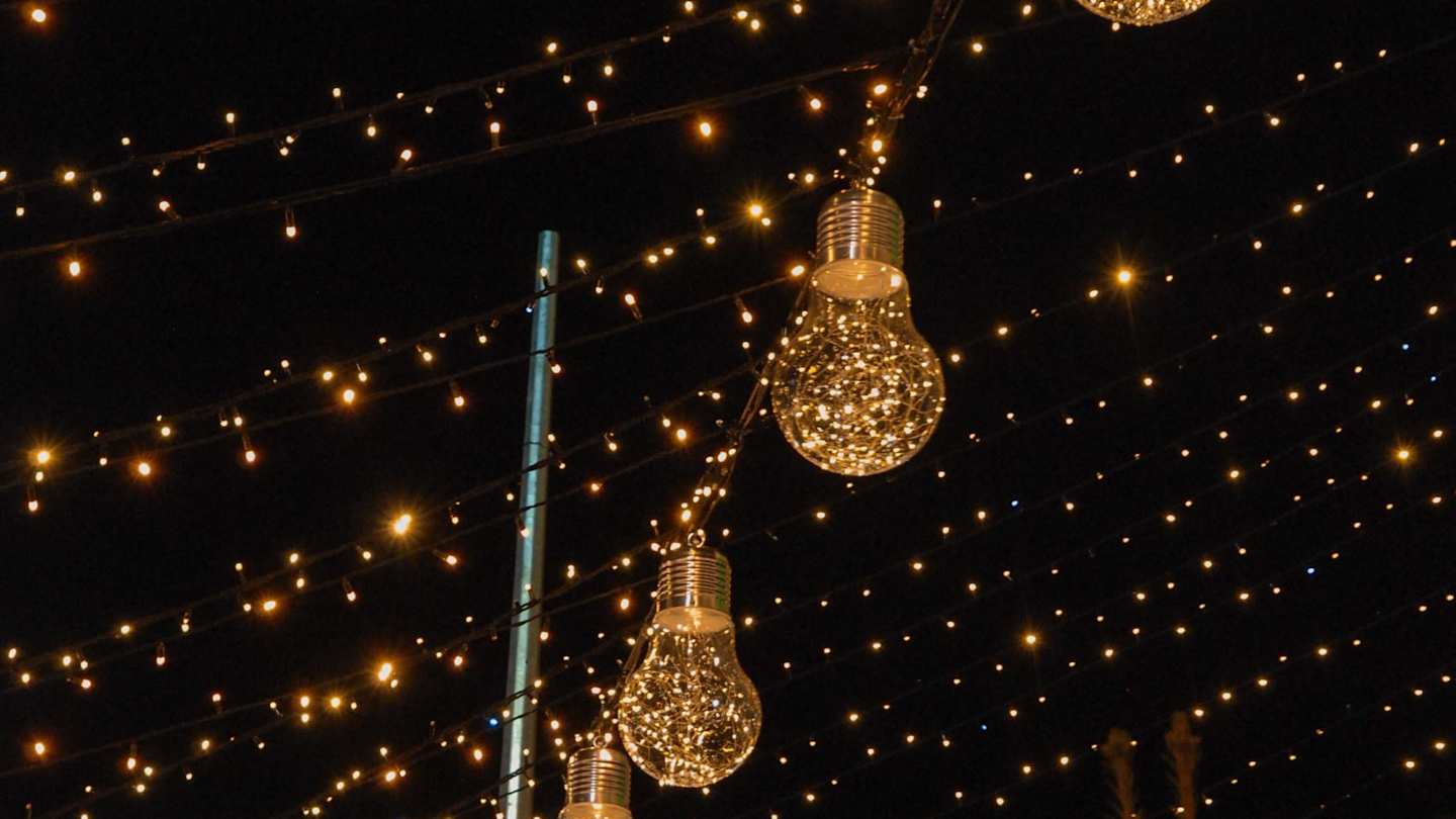 Christmas lights overhanging a street
