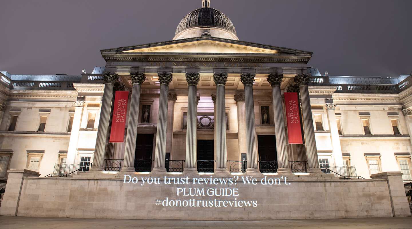 Absurd 1-star review projected onto The National Gallery, London
