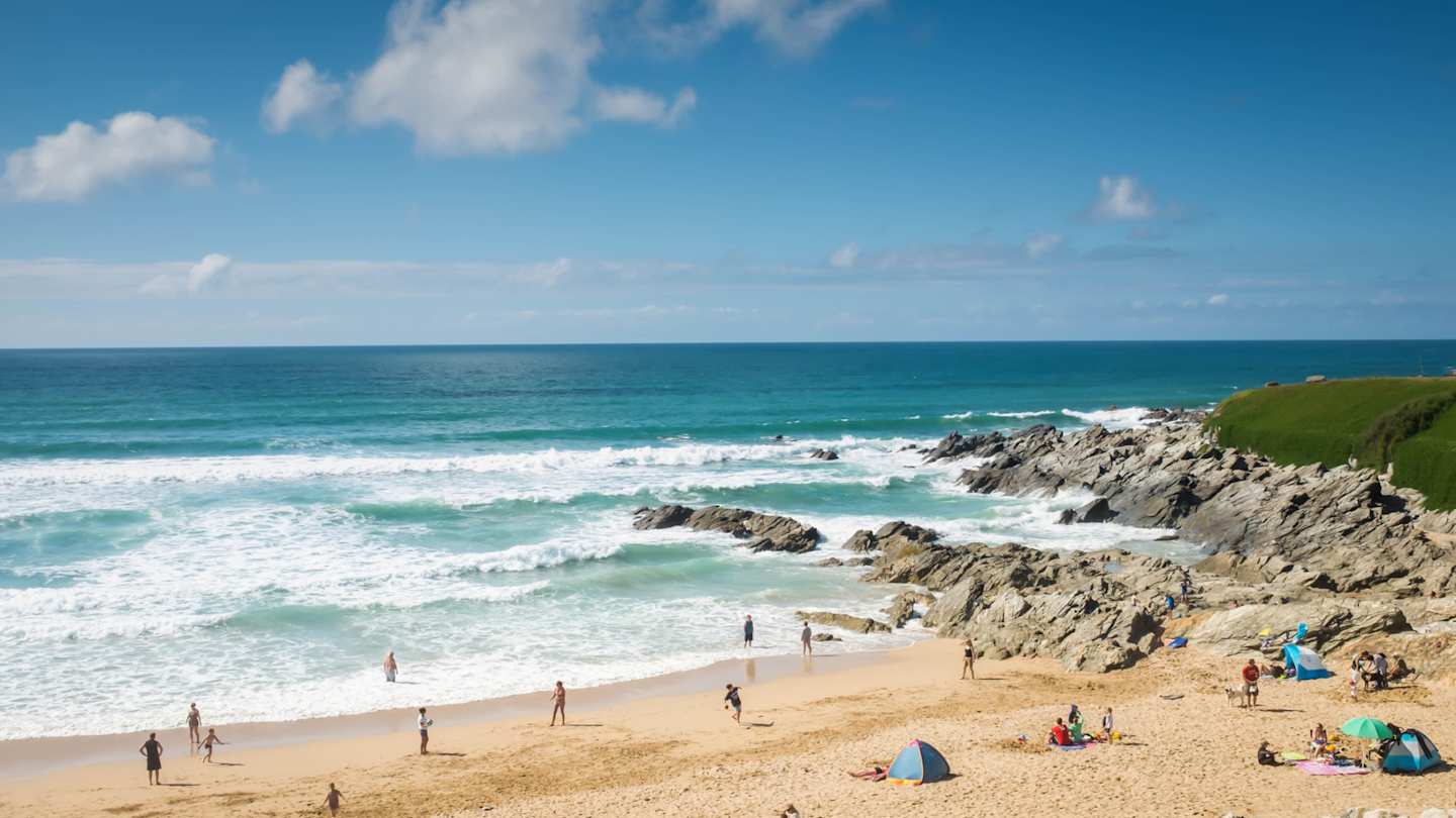 Families relaxing and playing on Fistral Beach near Newquay, Cornwall