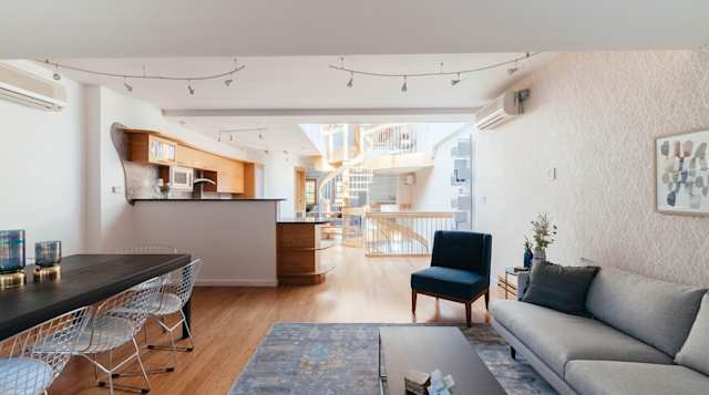 Open plan living and dining area and spiral staircase in background in Plum Guide home, The Scandi Spiral