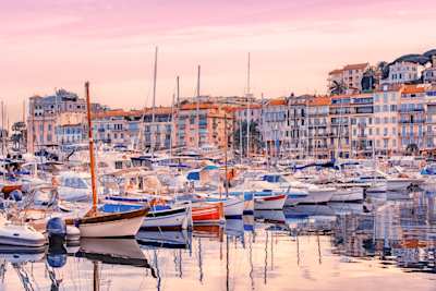 Fishing boats and yachts in Old Harbour at sunset, Cannes