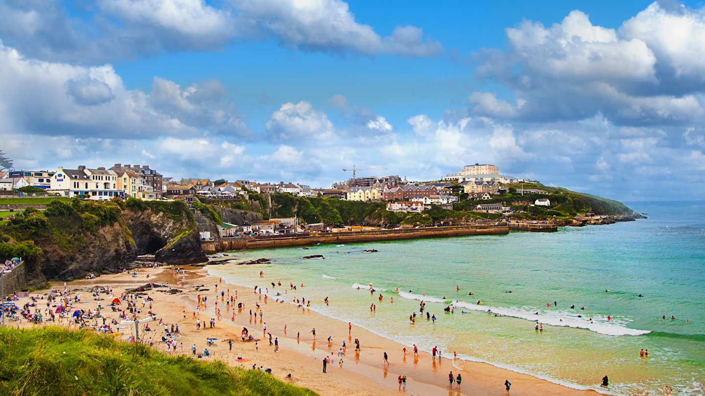 An aerial view of people on a beach in summer, Newquay, Cornwall, UK