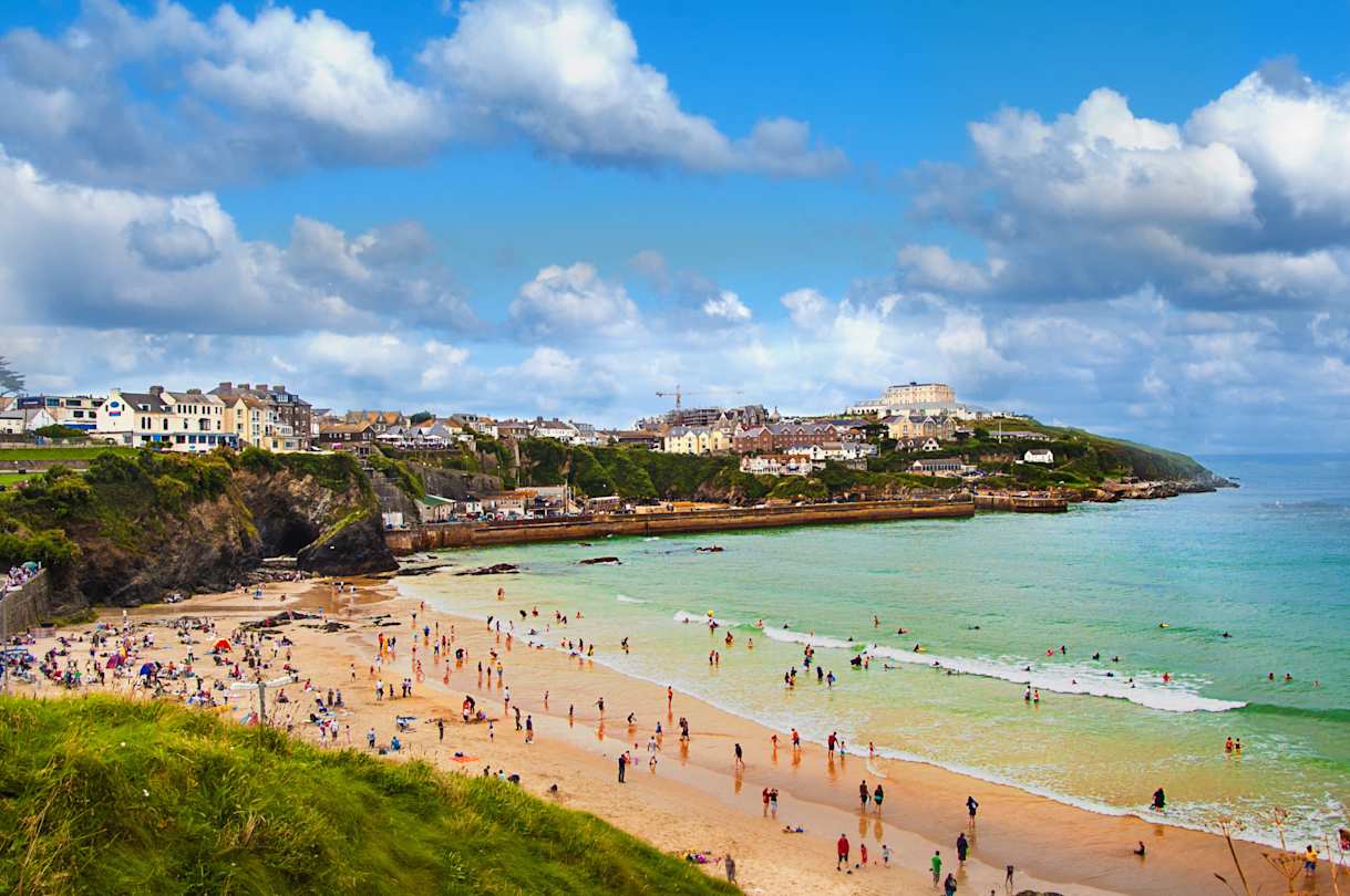 An aerial view of people on a beach in summer, Newquay, Cornwall, UK