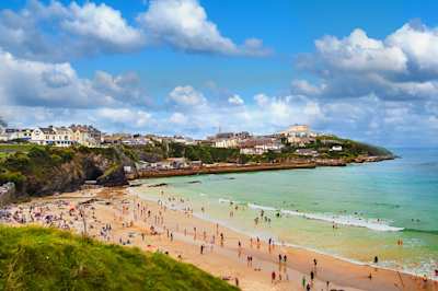 An aerial view of people on a beach in summer, Newquay, Cornwall, UK