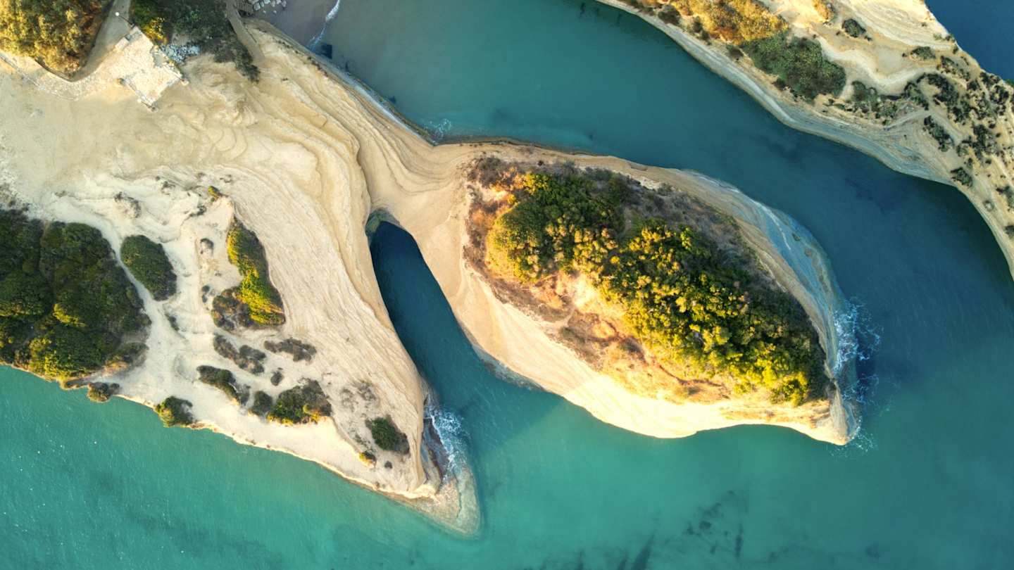 Pastel-coloured mountains and the sea at the Channel of Love from above, Corfu, Greece