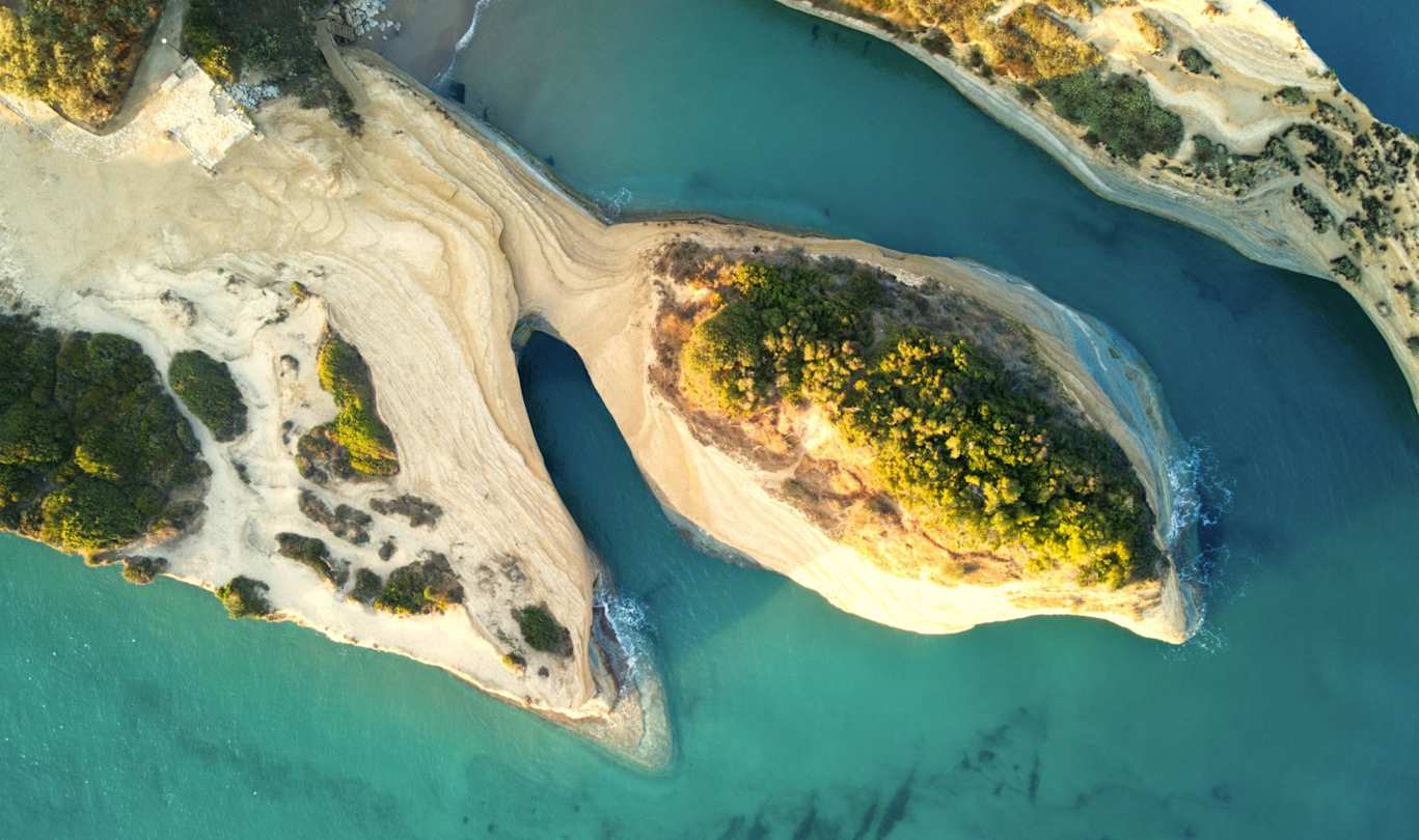 Pastel-coloured mountains and the sea at the Channel of Love from above, Corfu, Greece