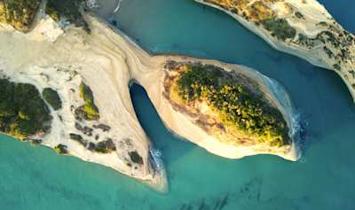 Pastel-coloured mountains and the sea at the Channel of Love from above, Corfu, Greece