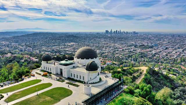 A view of Griffith Observatory on top of a hill, overlooking Los Angeles, USA