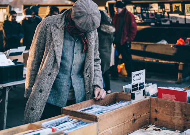 Man browsing a market stall in Southbank, London