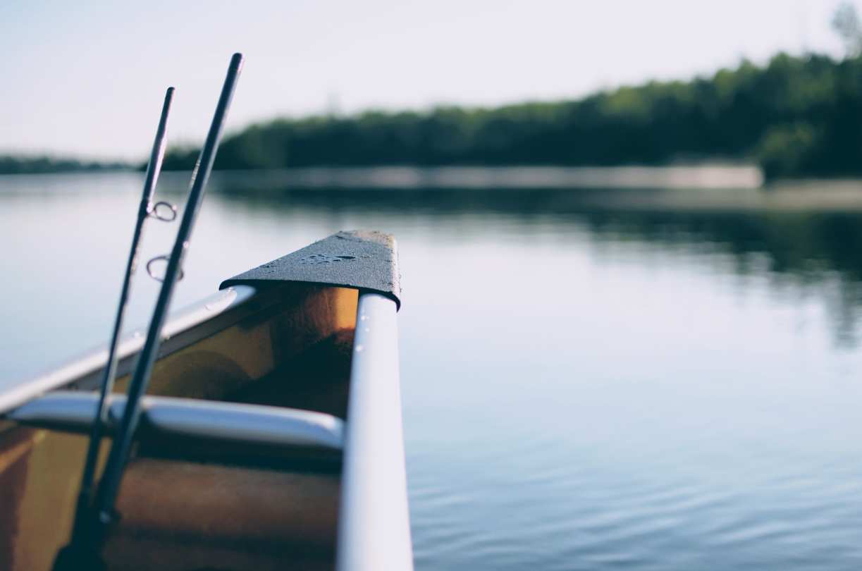 Boat on water with fishing rods